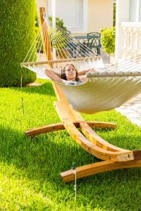 girl in hammock on stand